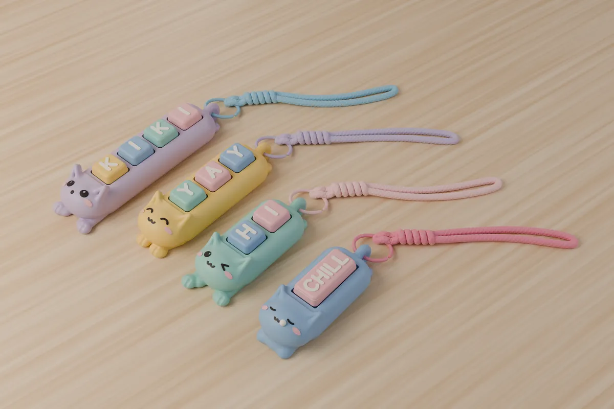 Four Kiki Cats face up with keys and cords: happy, wink, sleepy and surprised